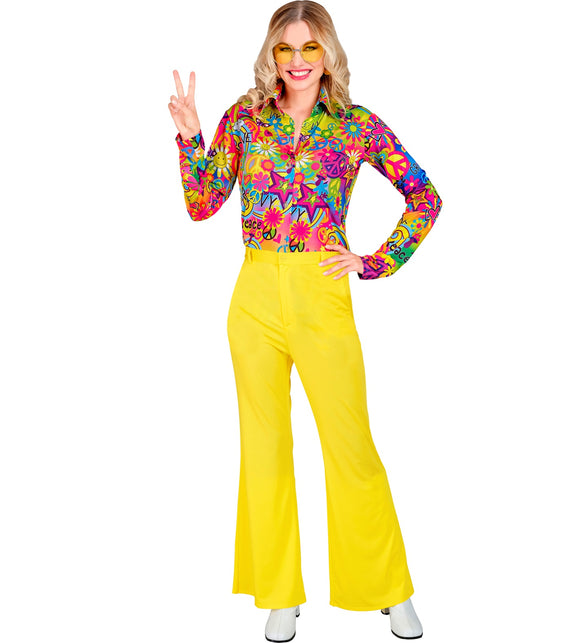 Gele jaren 70 broek dames gedragen - hippie discobroek flower power sixties
