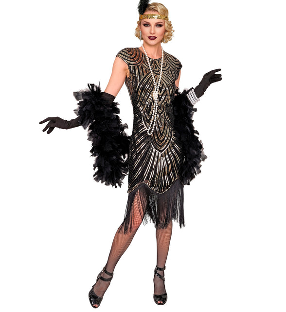 Flapper jurk goud zwart met art-decomotief, gedragen op een jaren 20-themafeest