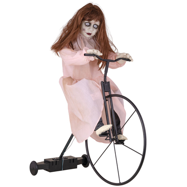 Cycling Cindy animatronic: spookmeisje in roze jurk op zwart hoogwielfietsje voor Halloween