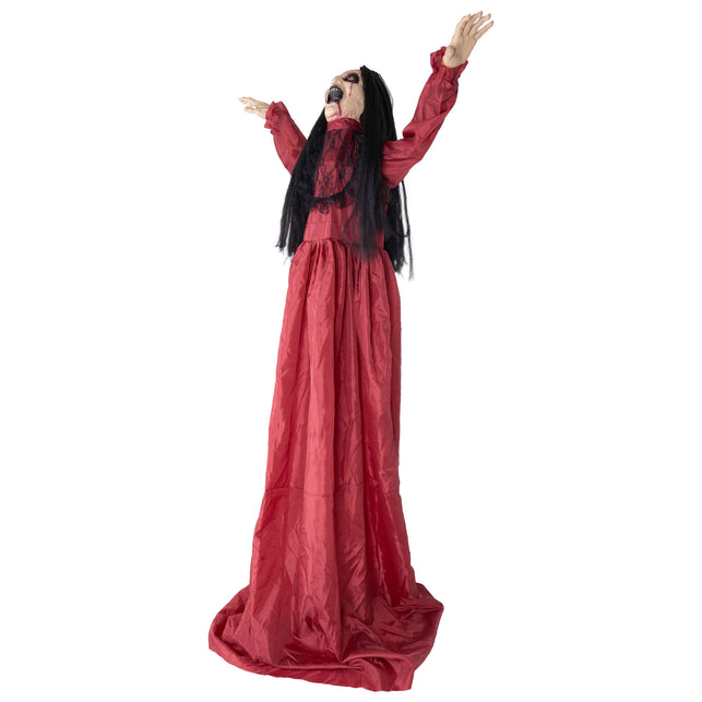 Halloween animatronic meisje van opzij, lange rode jurk met sleep en zwart kant op het lijfje