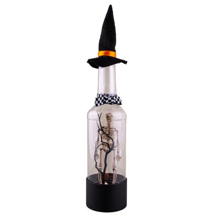 Halloween fles mini landschap met skeletfiguur tussen zwarte takken, punthoed en geblokt strikje