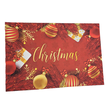 Kerstdeurmat 'Christmas' van bovenaf, rode print met gouden kerstballen, strikjes en sneeuwvlokken