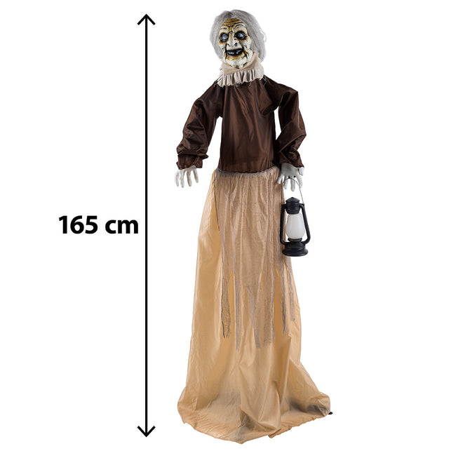 Lantern witch heksenfiguur van 165 cm hoog met grijs haar, bruine blouse en gazen rok