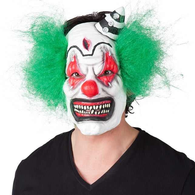Latex horror clown masker met groen haar, rode neus en grijnzend gebit voor Halloween