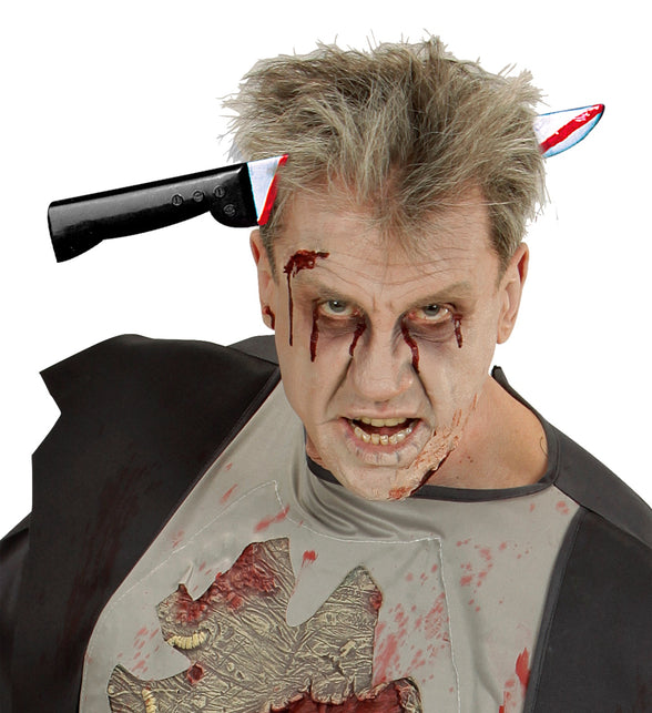 Mes door hoofd hoofdband op zombielook, zilveren punt en zwart heft aan weerszijden