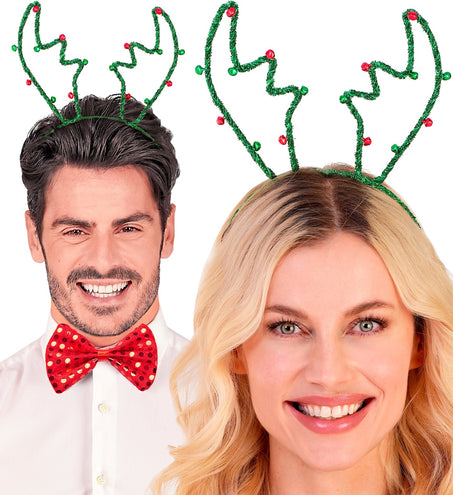 Rendier hoofdband groen gedragen door man en vrouw tijdens een kerstborrel
