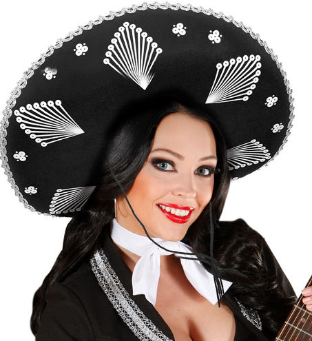 Sombrero Noah Mexico op een dame, witte waaiermotieven en stippen onder de zwarte rand