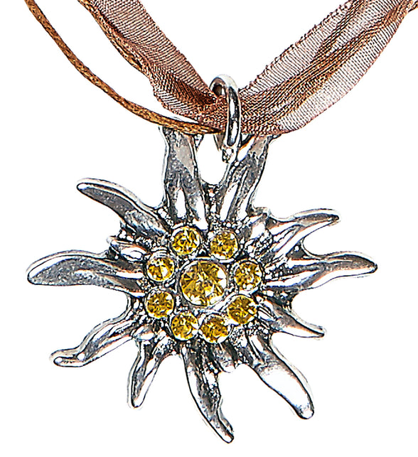 Tiroler halsketting edelweiss close-up: zilverkleurige edelweissbedel met gele steentjes aan bruin lint