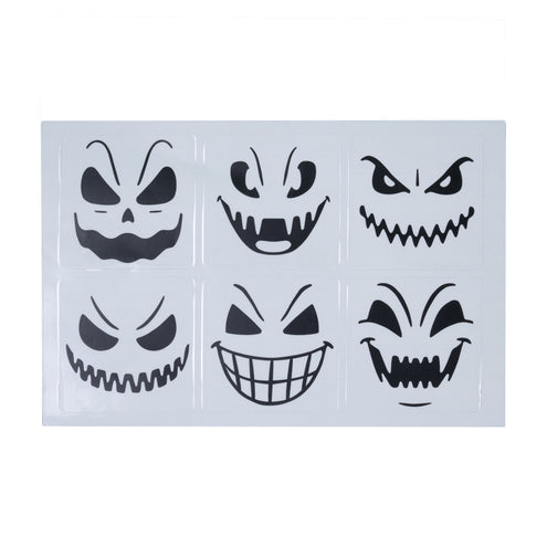 Vel met zes zwarte halloween glasstickers, elk met een ander griezelig gezicht van 5x5 cm
