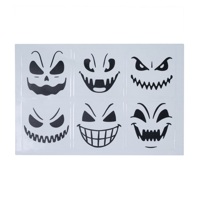 Vel met zes zwarte halloween glasstickers, elk met een ander griezelig gezicht van 5x5 cm