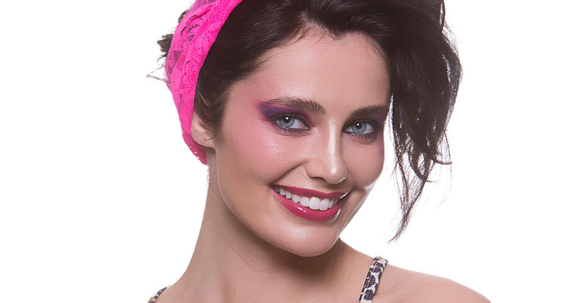 Wicked Costumes Haarband 80-jaren neon roze met strik