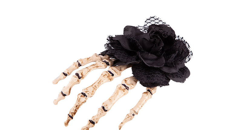 Wicked Costumes Hand skelet haarclip met zwarte roos